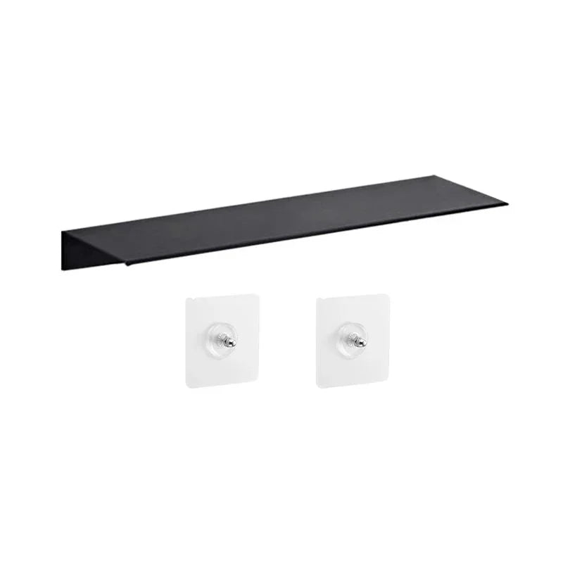 Black floating shelf with adhesive wall mounts for modern home organization