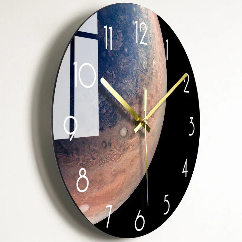 Modern wall clock with Jupiter planet design, gold hands, black and white face, ideal for home or office decor