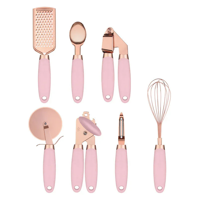 Pink and rose gold kitchen tools set: grater, spoon, garlic press, whisk, peeler, can opener, pizza cutter