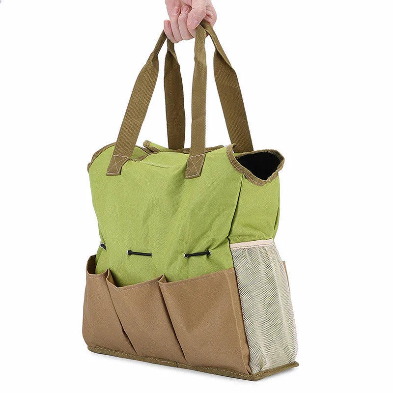 Green and beige garden tote bag with multiple pockets and sturdy handles for outdoor tools and supplies