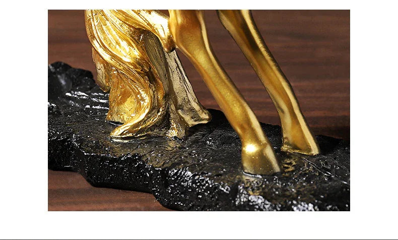 Golden horse statue legs on textured black base, luxury home decor accent piece