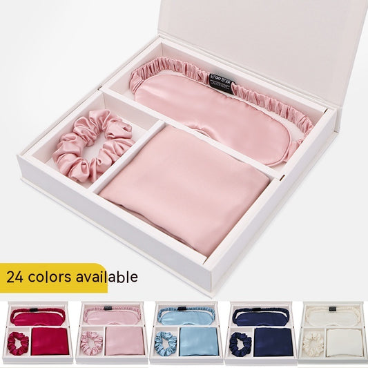 Luxury silk gift set with sleep mask, scrunchie, and pillowcase in pink, available in 24 colors