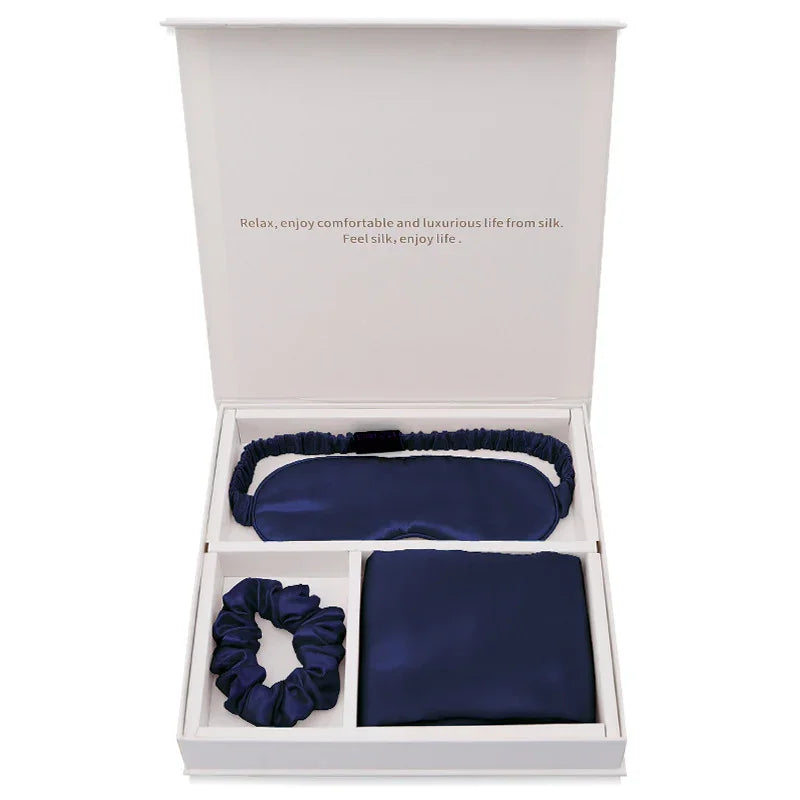 Navy blue silk sleep mask, pillowcase, and scrunchie gift set in white box