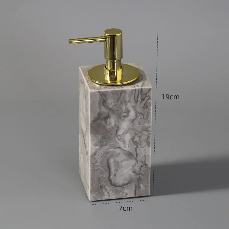 Rectangular marble liquid soap dispenser with gold pump, 19cm tall, 7cm wide.