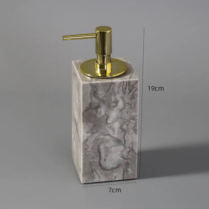 Rectangular marble liquid soap dispenser with gold pump, 19cm tall, 7cm wide.