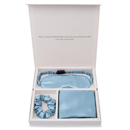 Light blue silk gift set with eye mask, scrunchie, and pillowcase in white box