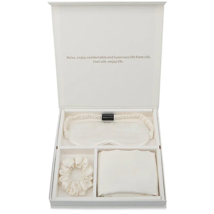 Luxury silk gift set with ivory sleep mask, scrunchie, and pillowcase in a white box
