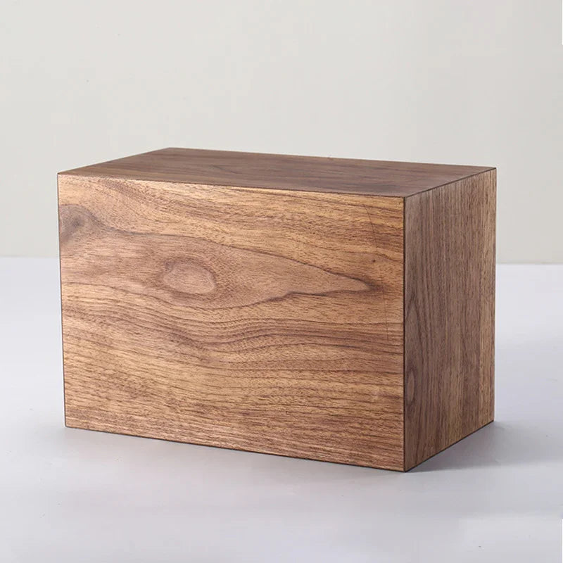Rectangular wooden box with natural grain on a plain light background