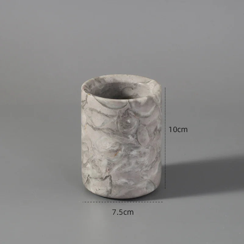 Marble-patterned cylindrical pen holder, 10cm tall, 7.5cm wide, on grey background