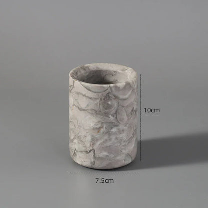Marble-patterned cylindrical pen holder, 10cm tall, 7.5cm wide, on grey background