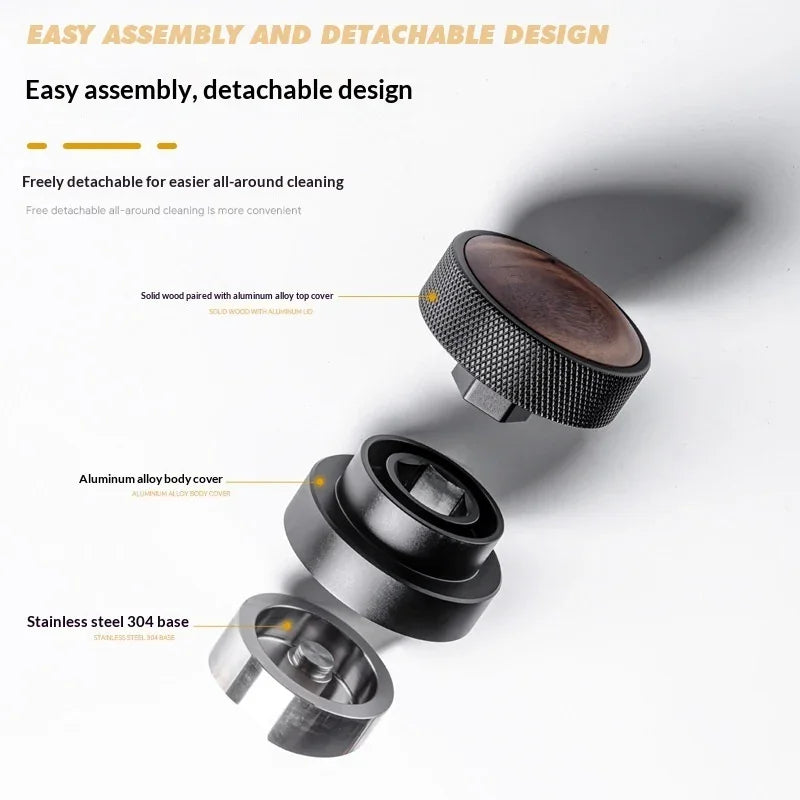 Exploded view of detachable espresso tamper with wooden top, aluminum body, and stainless steel base.