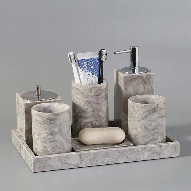 Marble bathroom accessories set with toothbrush holder, soap dispenser, cups, and tray