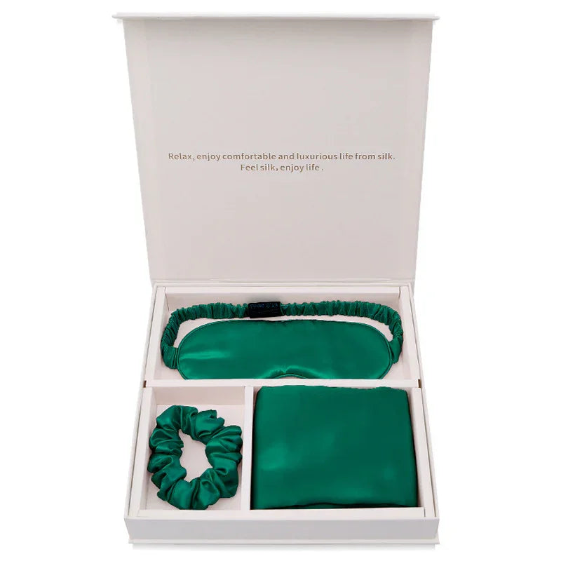 Green silk sleep mask, scrunchie, and pillowcase gift set in white box