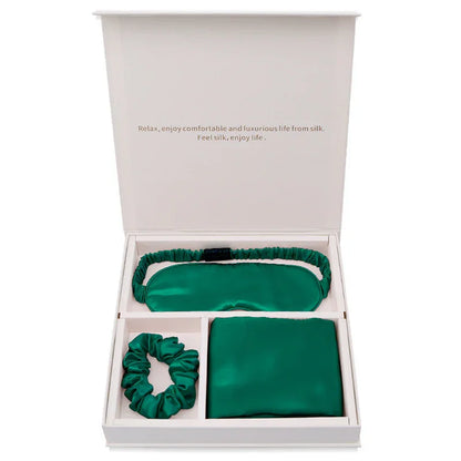 Green silk sleep mask, scrunchie, and pillowcase gift set in white box