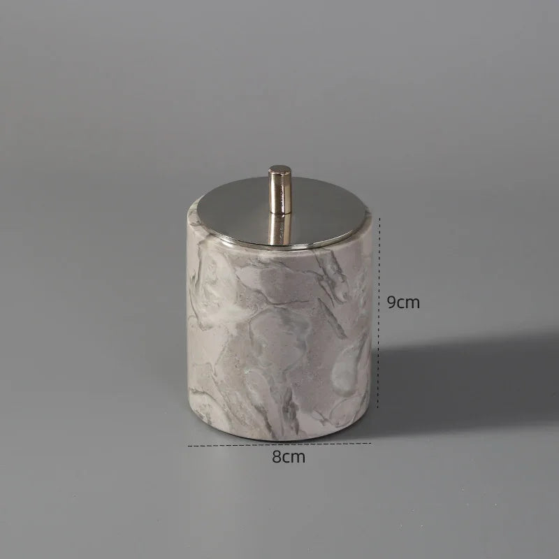 Modern marble-patterned storage jar with metallic lid, 9cm tall and 8cm wide, on gray background