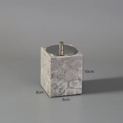 Square marble container with silver lid, 10cm tall, 8cm wide, on gray background