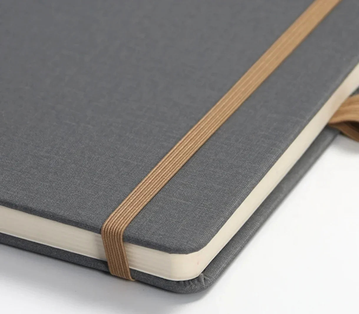 Gray hardcover notebook with elastic band for office or school use