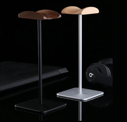Sleek wooden headphone stands with black and silver bases for desk organization